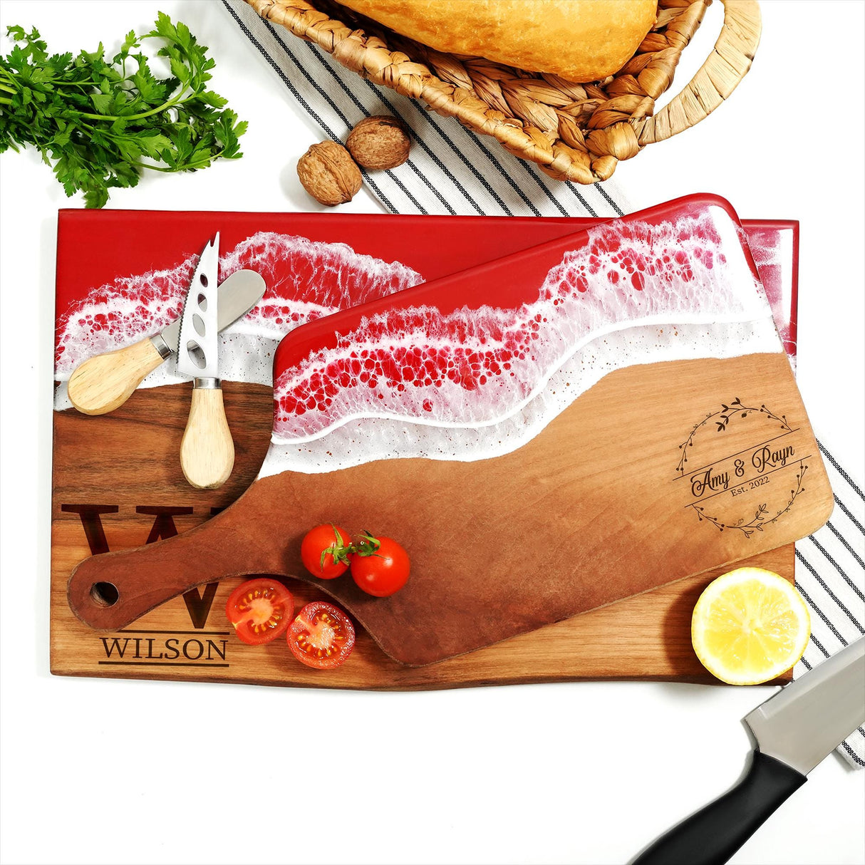 a cutting board with a knife and some tomatoes on it
