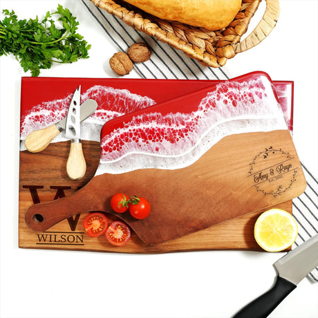 a cutting board with a knife and some tomatoes on it