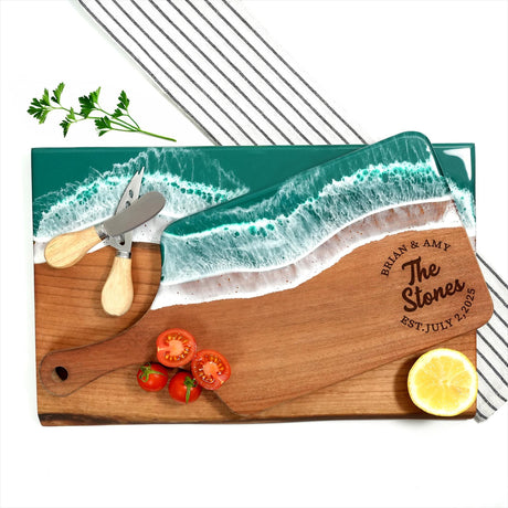 a cutting board with a knife, lemon and tomatoes on it