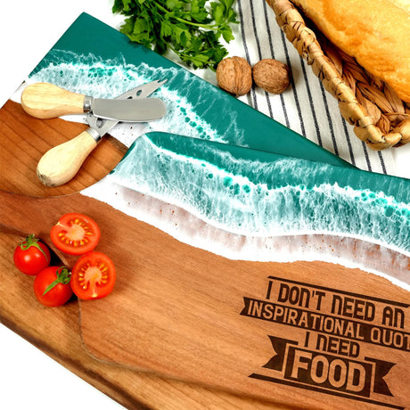 a cutting board with a knife, tomatoes and bread on it