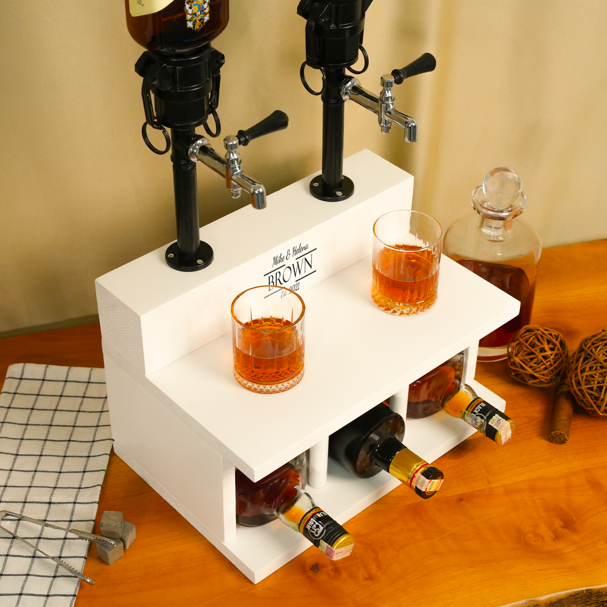 White double-duty bar with two glasses of amber liquid and bottles on a wooden surface.