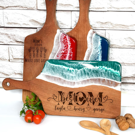 a couple of wooden cutting boards sitting on top of a table