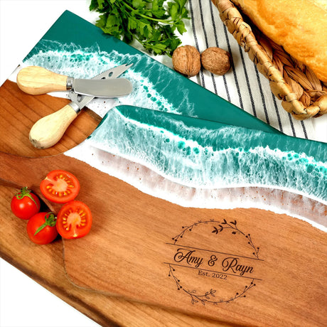 a cutting board with a knife and tomatoes on it