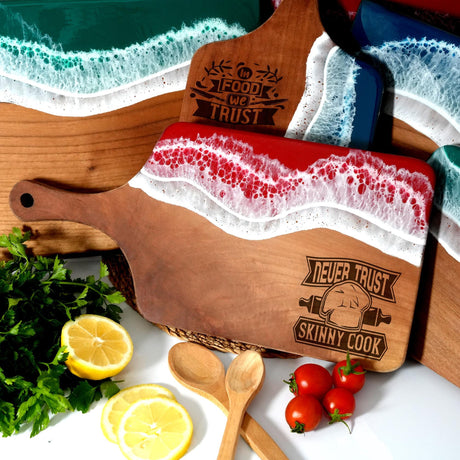 a wooden cutting board with a red and white design on it