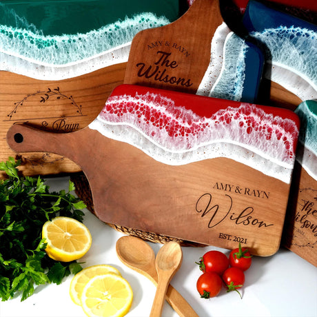 a wooden cutting board with a red and white towel on top of it