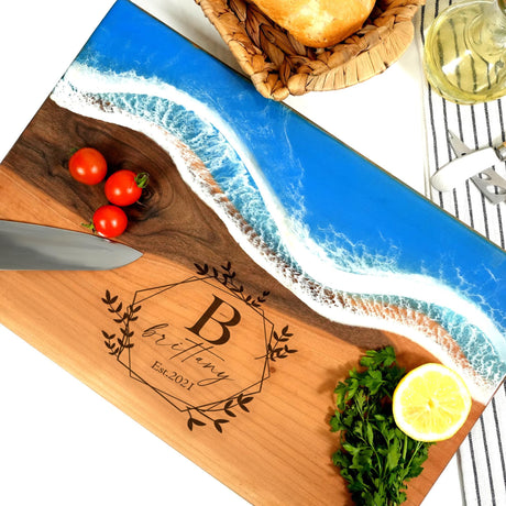 a cutting board with a knife and tomatoes on it
