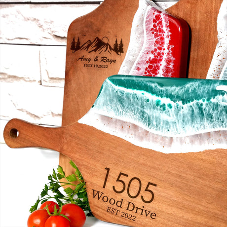 a wooden cutting board with a knife and tomatoes on it