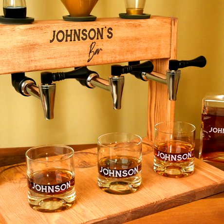 a wooden shelf with whiskey bottles and glasses