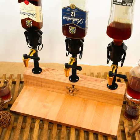 Three beer bottles on a wooden board with 'J Jones' branding, surrounded by glasses of beer.