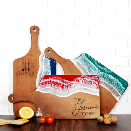 a couple of cutting boards sitting on top of a table