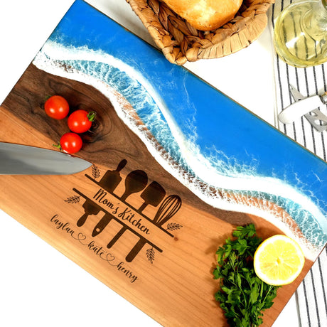 a cutting board with a knife and tomatoes on it