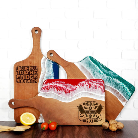 a couple of cutting boards sitting on top of a table