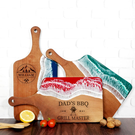 a wooden cutting board with a knife and a cutting board with a picture of a