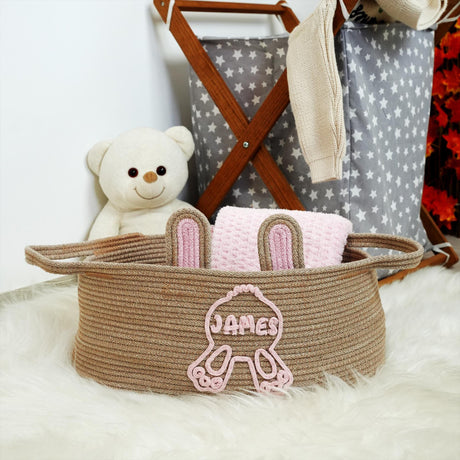 a teddy bear is sitting next to a basket