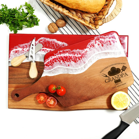 a cutting board with a knife and some tomatoes on it
