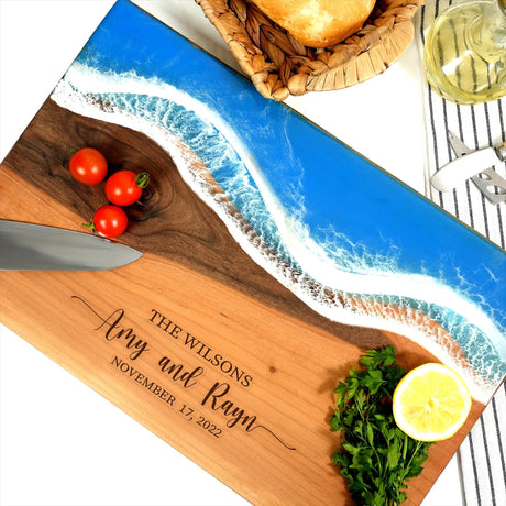a cutting board with a knife and tomatoes on it