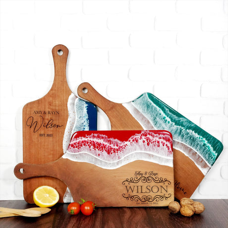 a couple of cutting boards sitting on top of a table