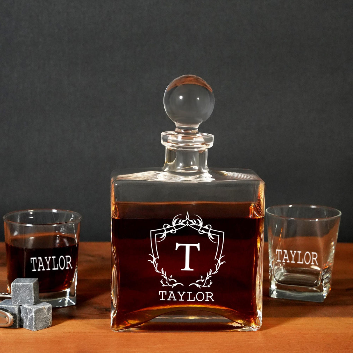 a bottle of taylor taylor whiskey next to two shot glasses