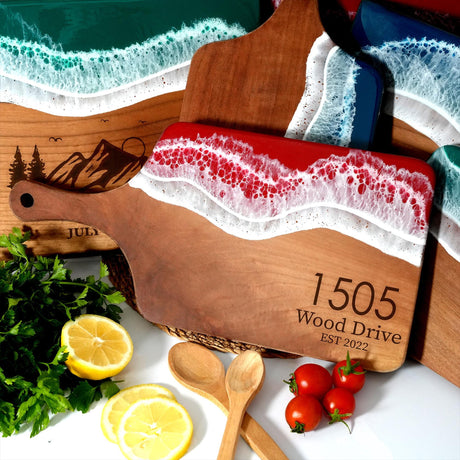 a cutting board with a knife, lemons, tomatoes and parsley