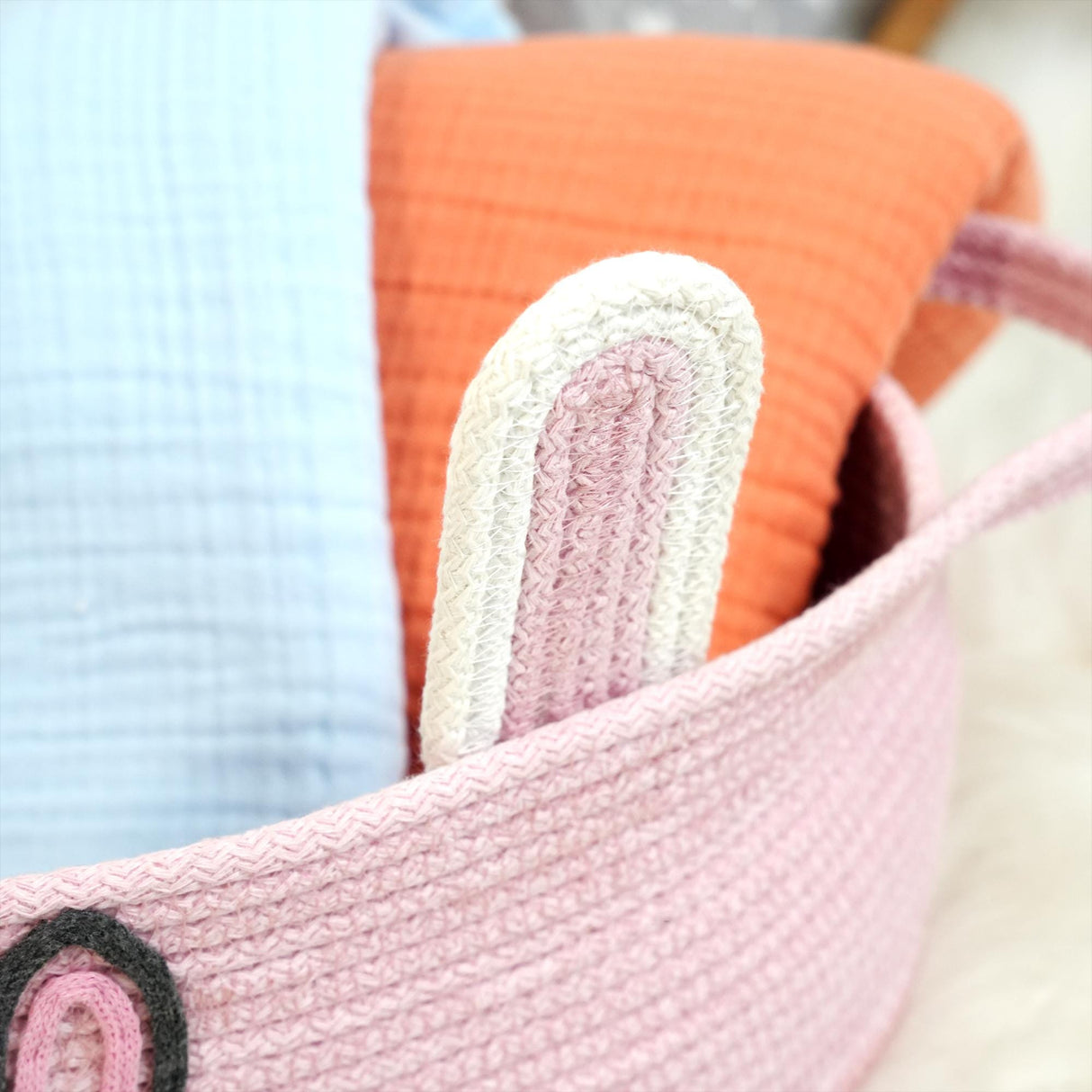 a close up of a basket filled with pillows
