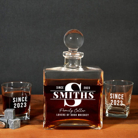 a bottle of smoth's whiskey next to two shot glasses