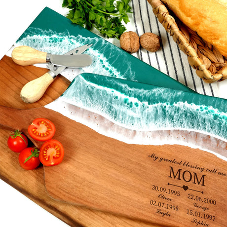 a cutting board with a knife and tomatoes on it