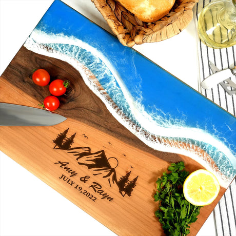 a cutting board with a knife and tomatoes on it