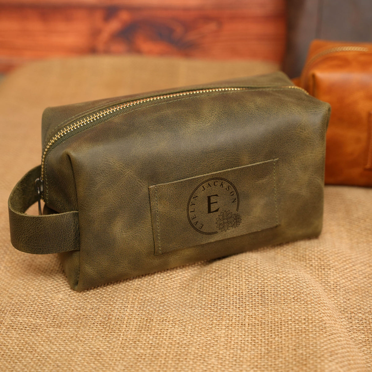 a brown leather bag sitting on top of a couch