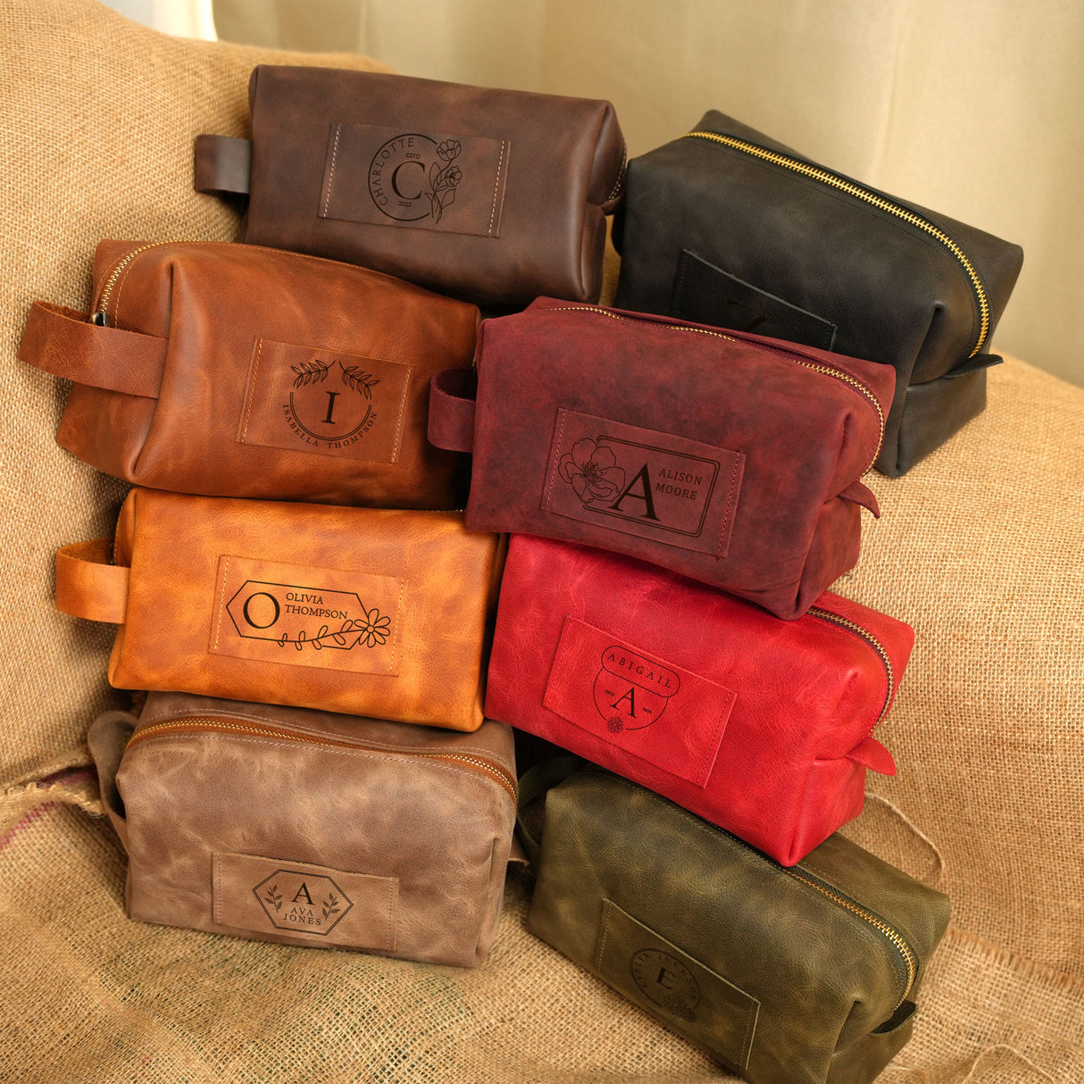 a group of leather bags sitting on top of a couch