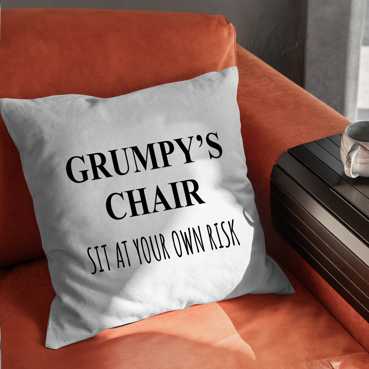 a pillow that says grump's chair sit at your own desk