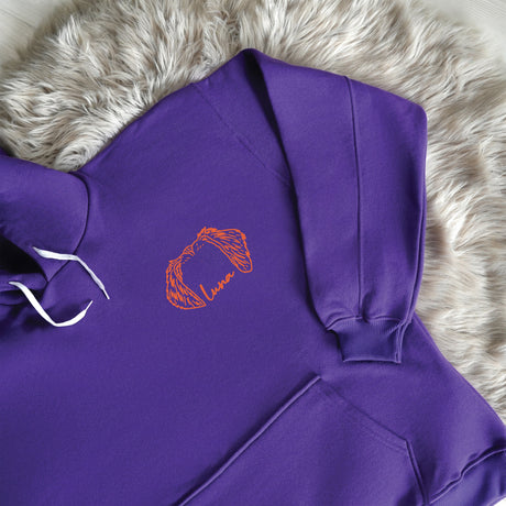 a purple hoodie with a picture of a woman's face on it
