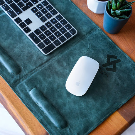 a keyboard and mouse pad on a table