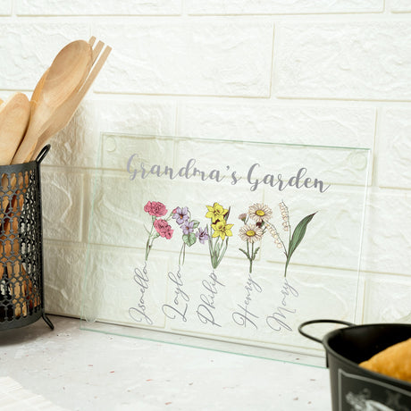 a kitchen counter with utensils and a sign that says grandma's garden