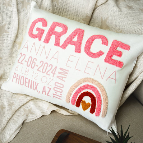 a pillow that has a picture of a rainbow on it