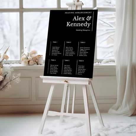 a black and white wedding seating sign in front of a window
