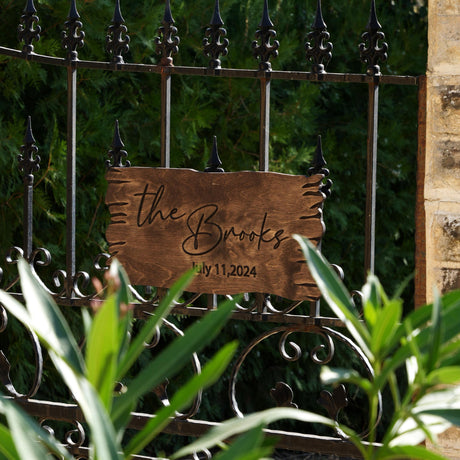 a close up of a metal fence with a sign on it