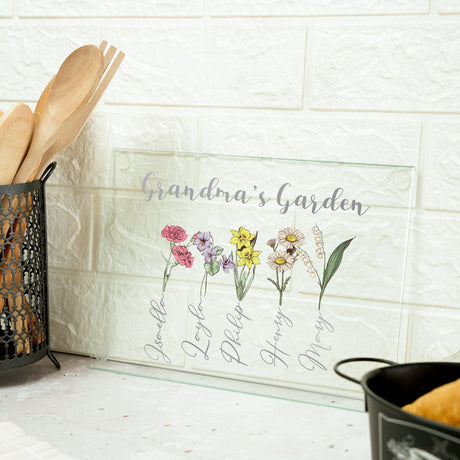 a kitchen counter with utensils and a sign that says grandma's garden