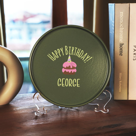 a birthday cake sitting on top of a wooden table