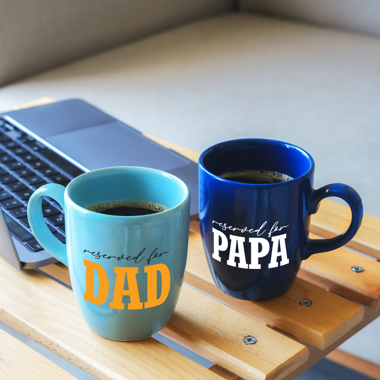 a laptop and a cup of coffee on a table
