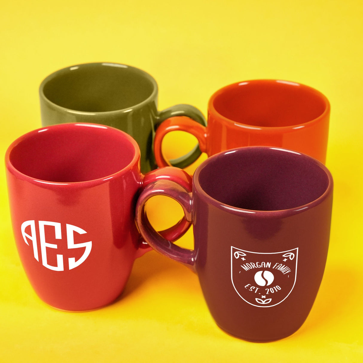 a group of four coffee mugs sitting next to each other
