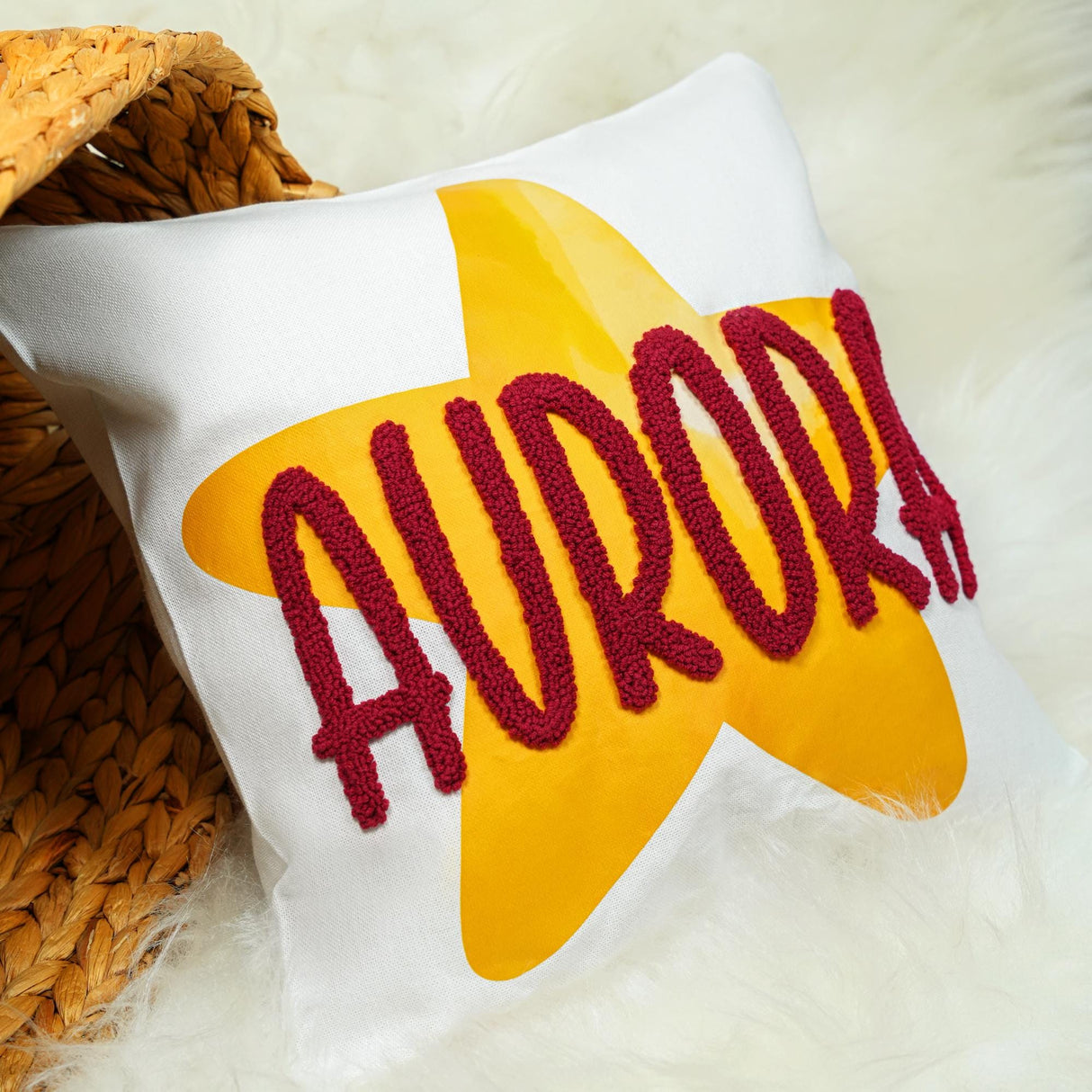 a pillow with the word aurora written on it