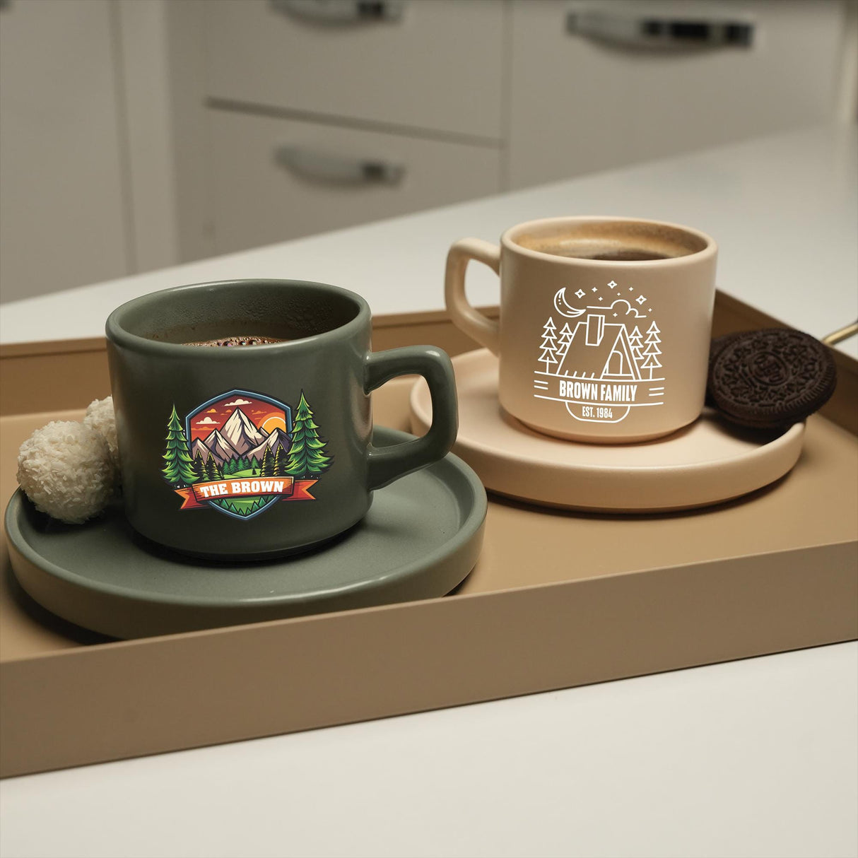 a cup of coffee and a cookie on a tray