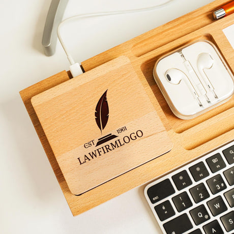 a wooden box with ear buds and a keyboard