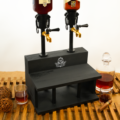 Black drink dispenser with two bottles on a wooden surface, featuring the Miller's logo.