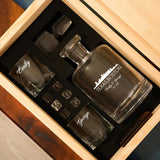 a wooden box with three glasses in it