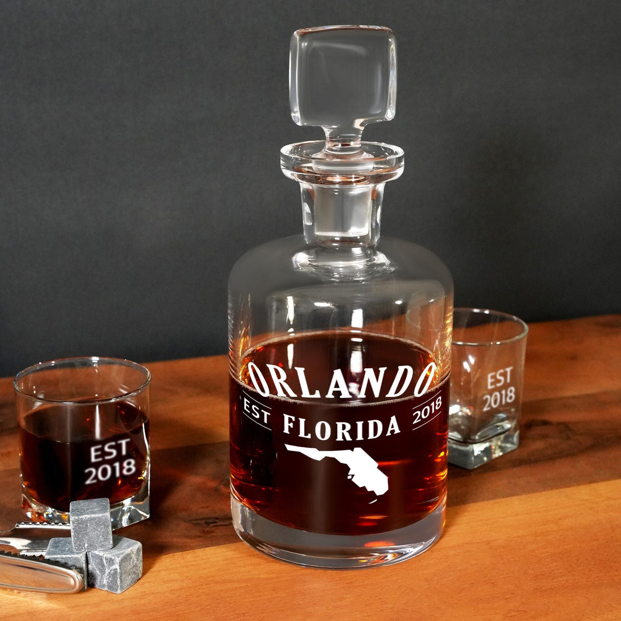 a bottle of liquor sitting on top of a wooden table