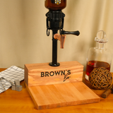 Wooden bar with 'Brown's Bar' branding, accompanied by a bottle and decorative items on a wooden surface.
