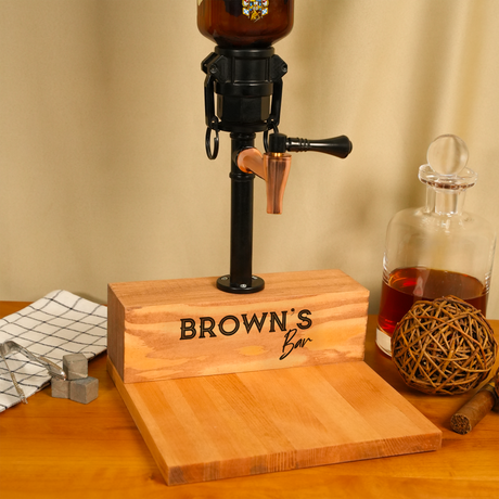 Wooden bar with 'Brown's Bar' branding, accompanied by a bottle and decorative items on a wooden surface.