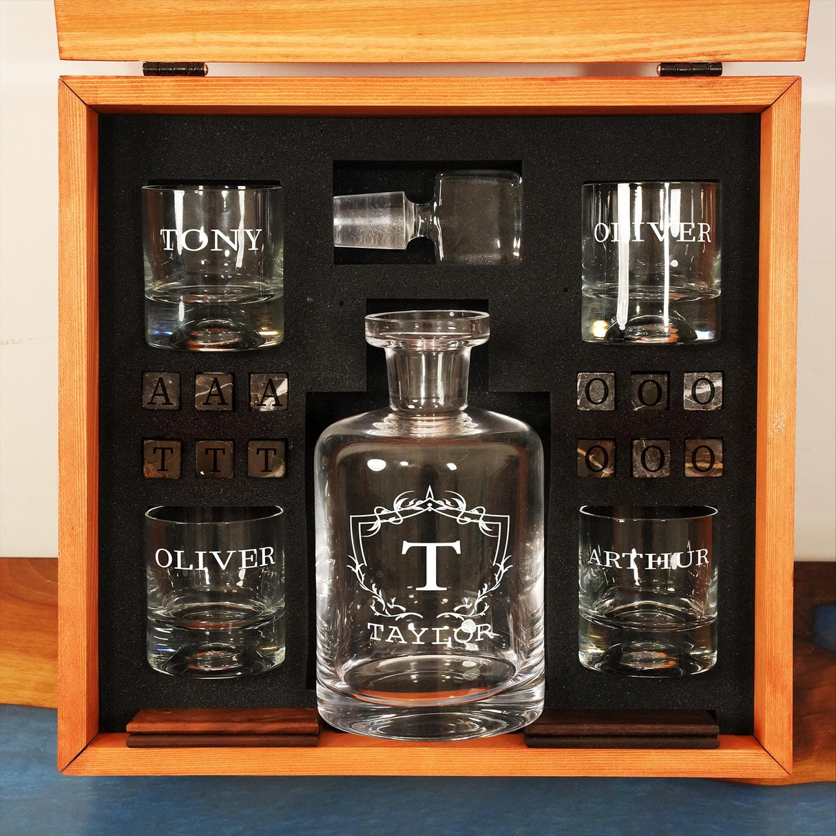 a set of glasses and a decanter in a wooden box