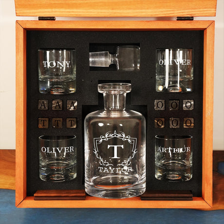 a set of glasses and a decanter in a wooden box
